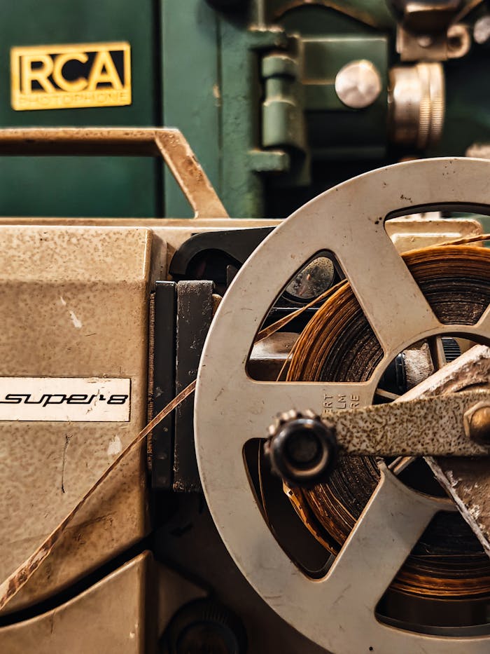 Detailed view of a vintage Super 8 film projector, showcasing its mechanical components and classic design.